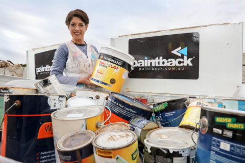 Karen Gomez CEO Paintback holding buckets of paint